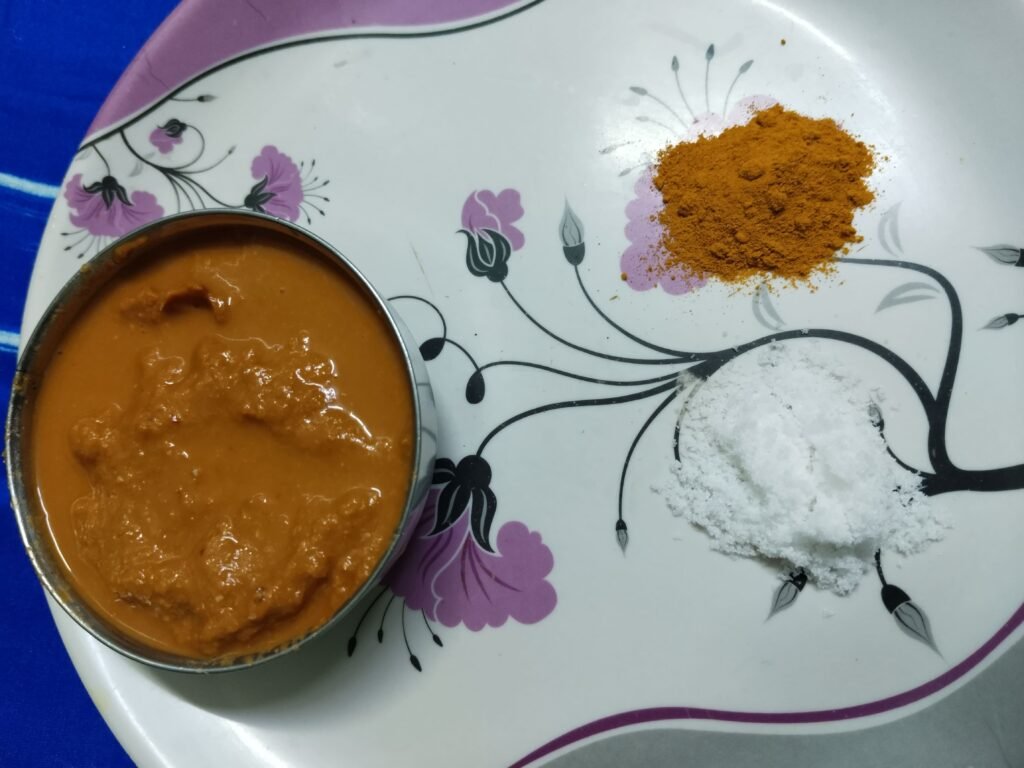 ground paste in steel bowl with turmeric and salt set aside separately for bottle gourd balls recipe