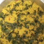 yellow rice recipe with potato cooked in one pot and garnished with fresh coriander leaves