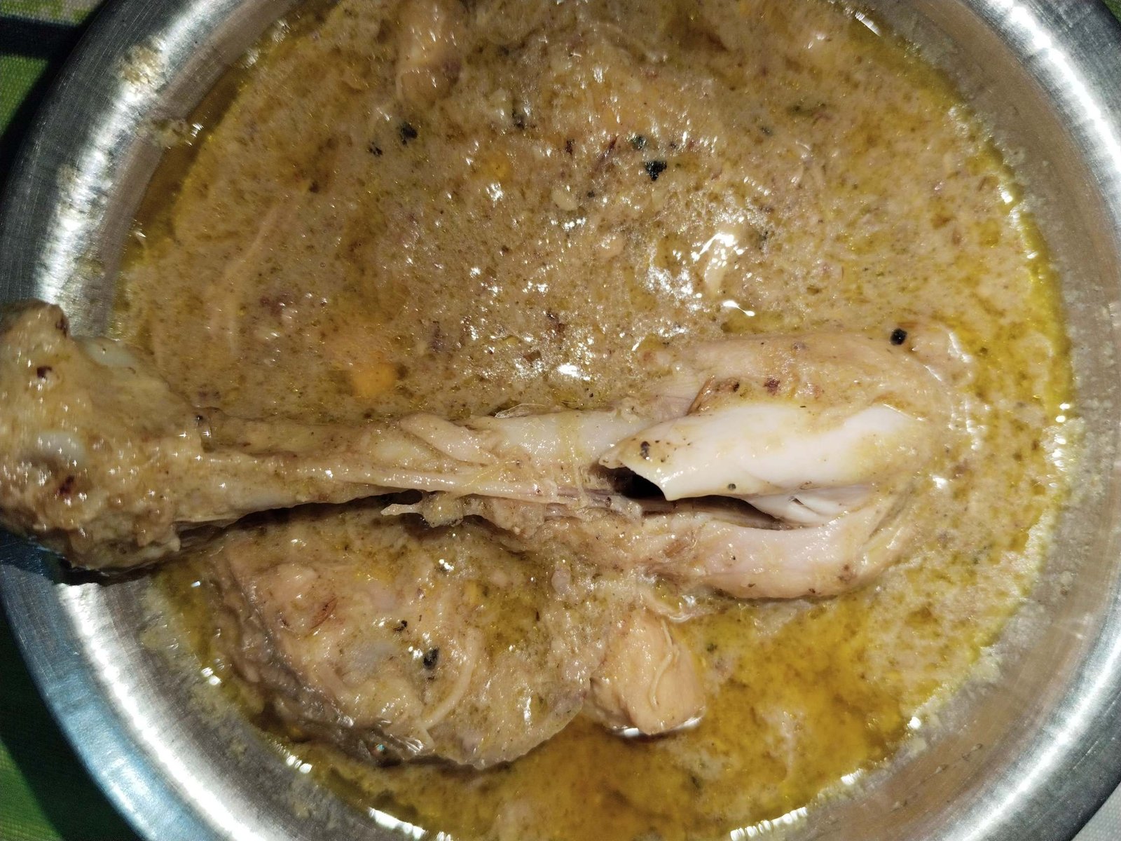 white creamy chicken recipe finished in pale golden creamy gravy in pot ready to serve
